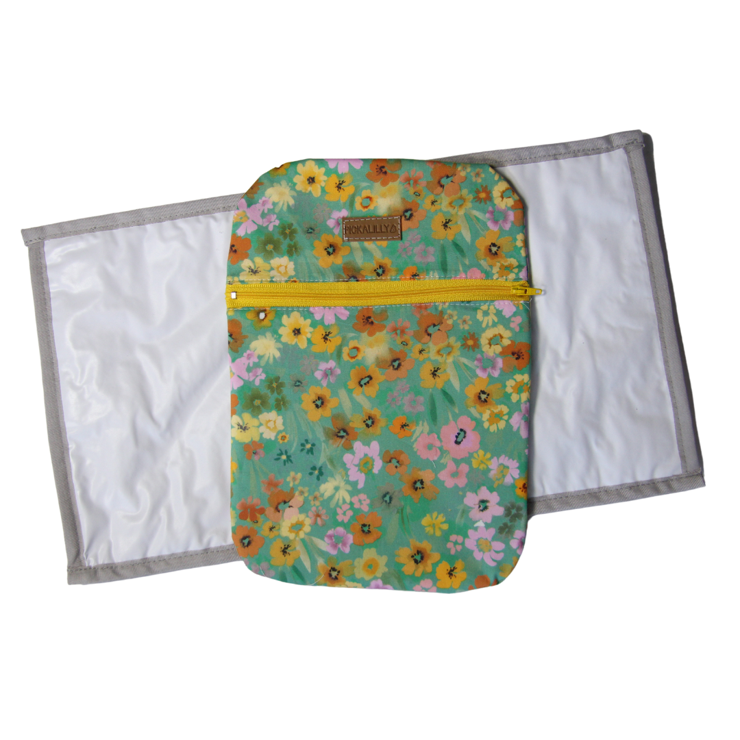 Green and yellow flowery diaper changing bags