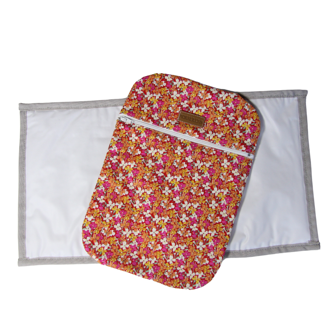 Pink and orange flowery diaper changing bags